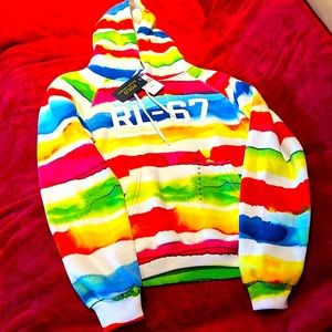 Multi colored hoodie/sweater/ sweatshirt with front pockets. Fits for comfort.